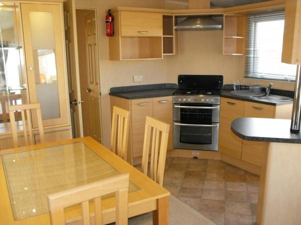 Dining Area ¦ Bronze caravan with outdoor decking area